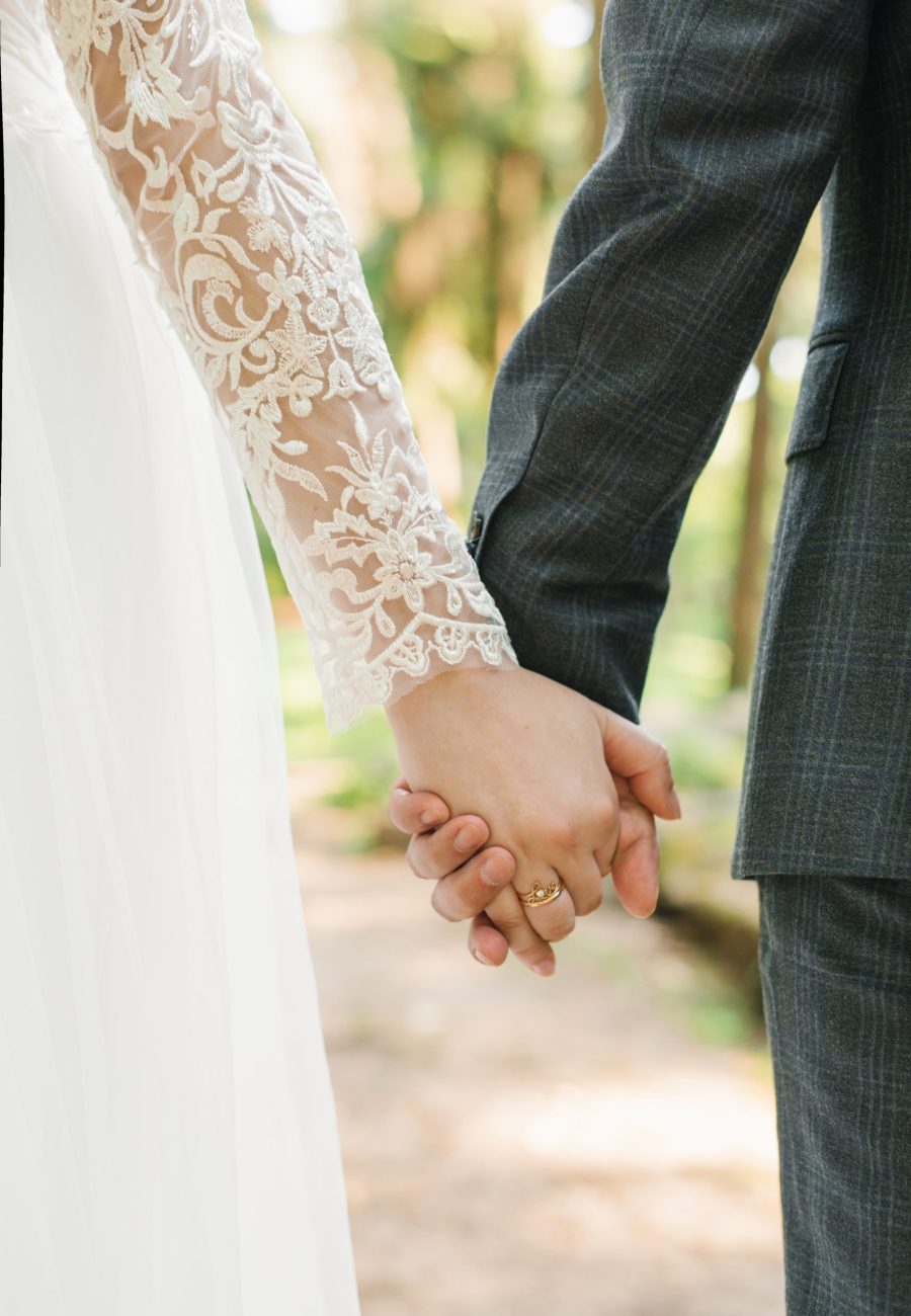 Wedding couple, lovers bride and groom holding hands go