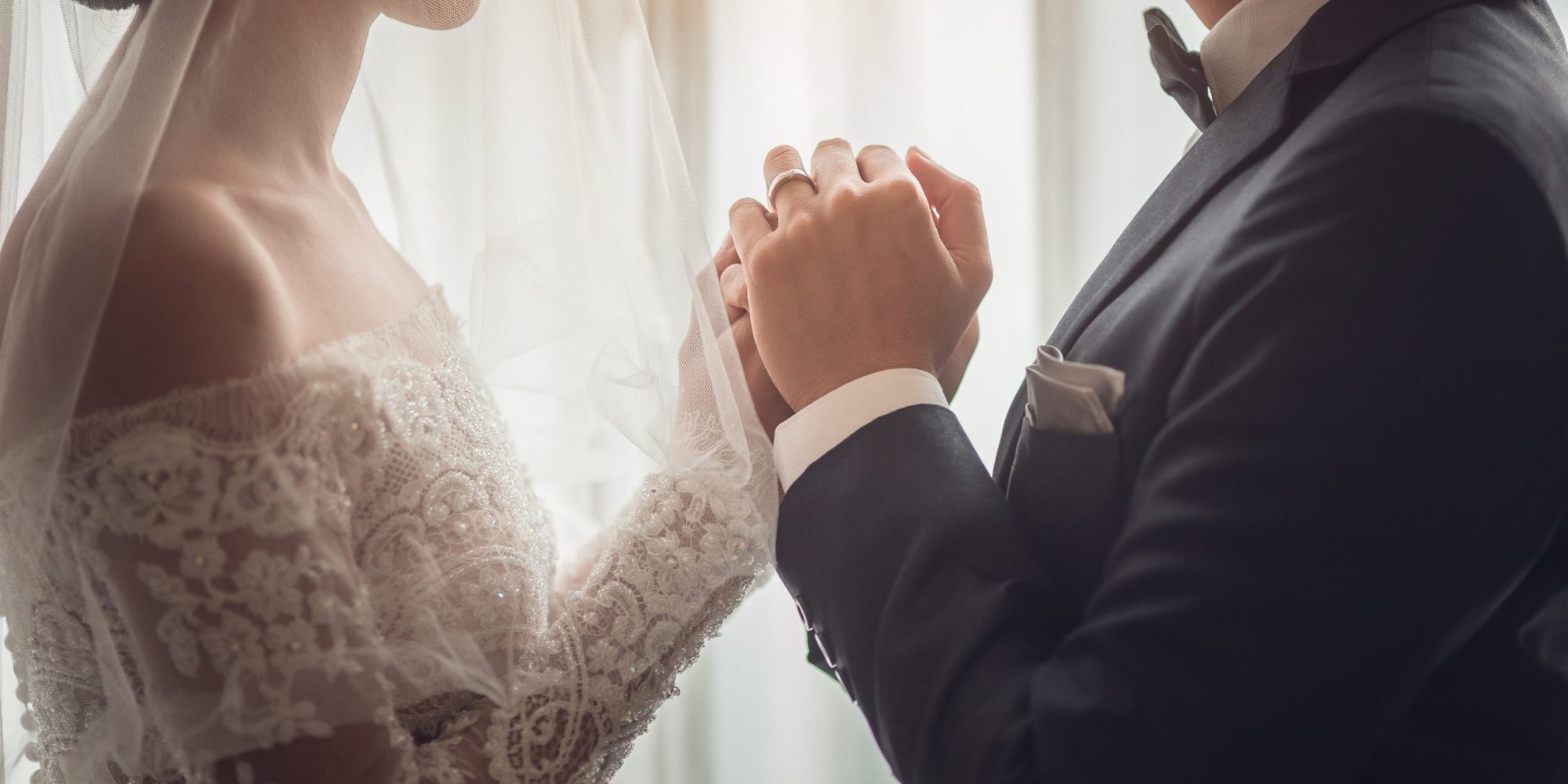 Holding Hands with wedding rings